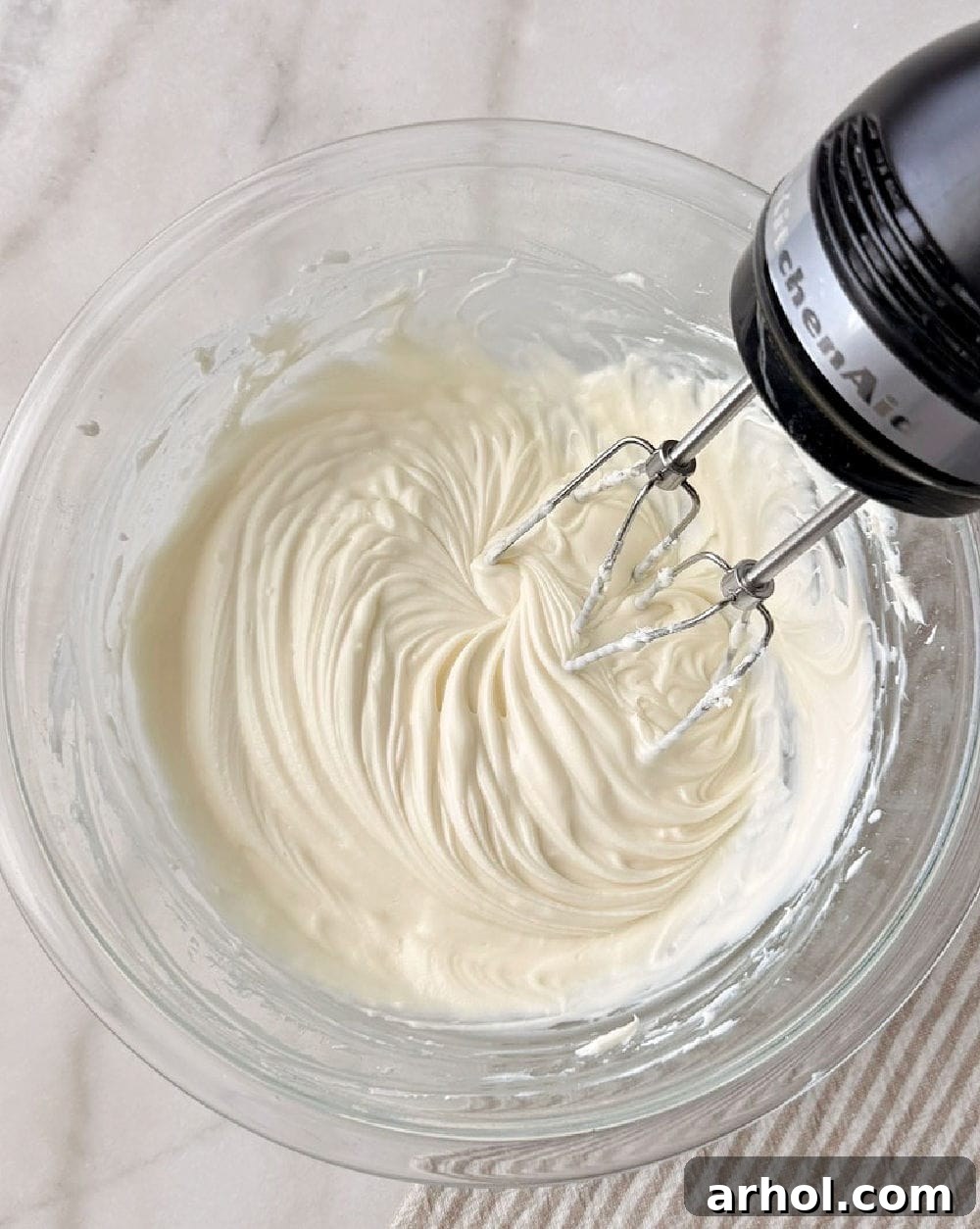mixing dip with electric mixer.