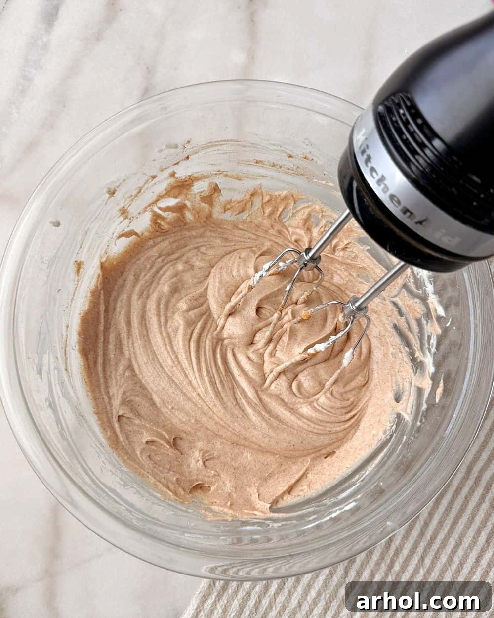 mixing in cinnamon.