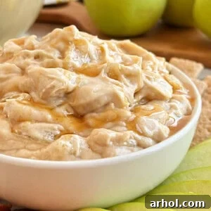 apple pie dip with caramel sauce in serving bowl.