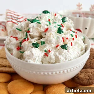 little Debbie Christmas tree cake dip with sprinkles and graham crackers on table