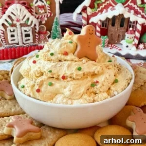 bowl of gingerbread dip with gingerbread man on top.