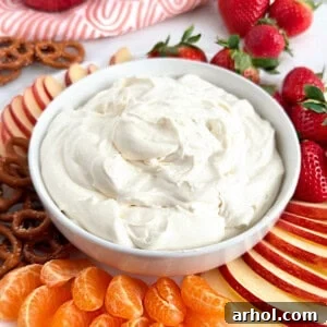 cool whip fruit dip with fresh fruit and pretzels.