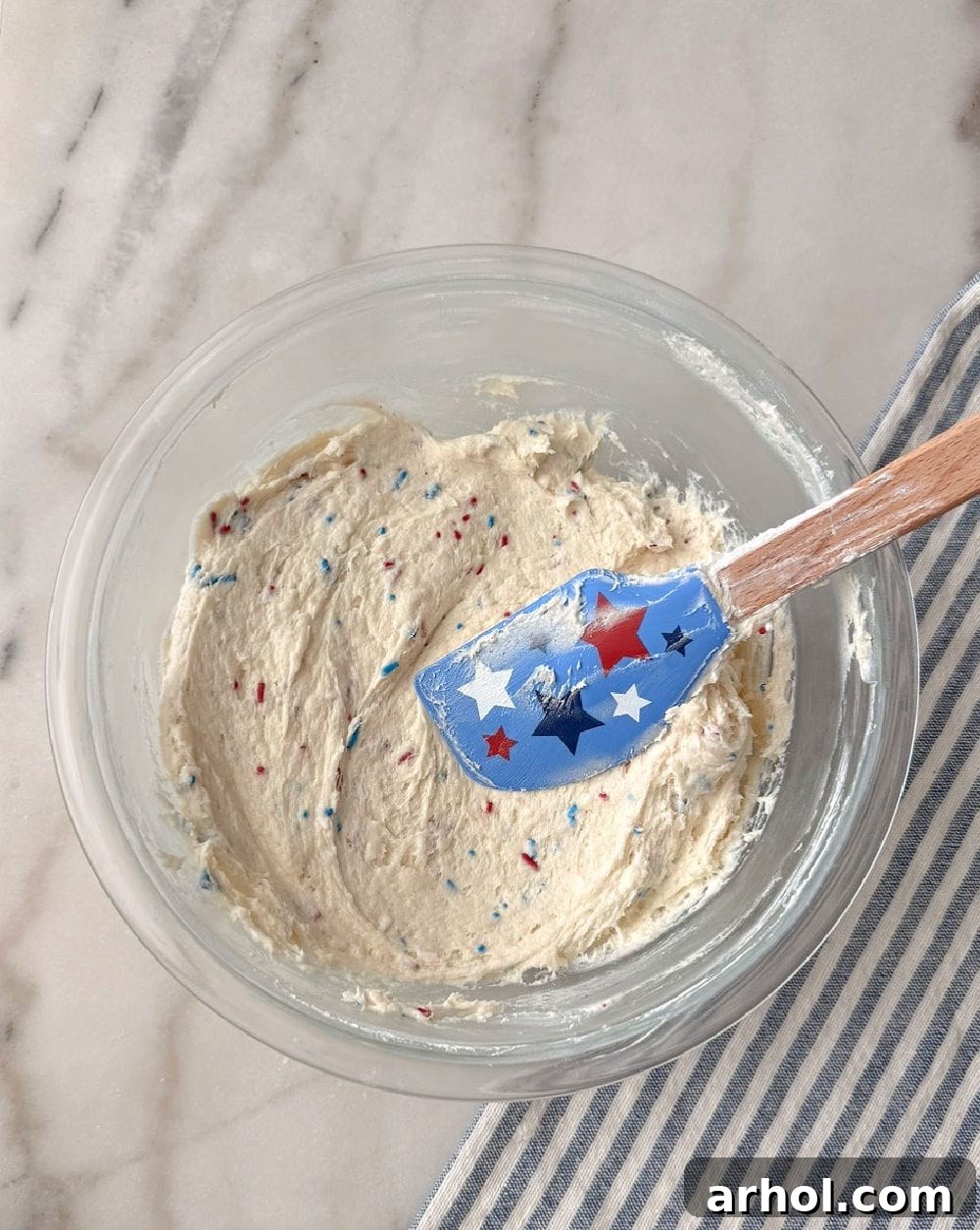 folding in sprinkles with star spatula.