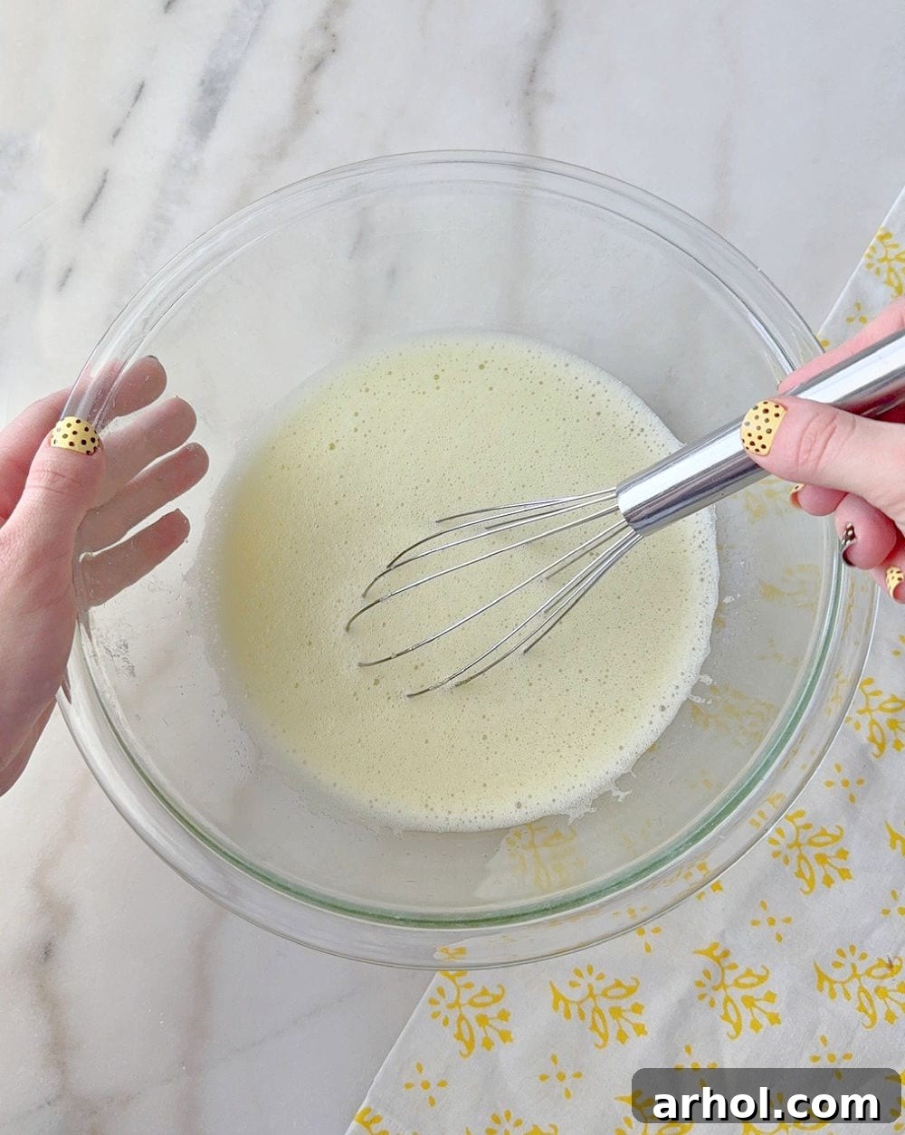 No-Bake Creamy Lemon Jello Pie 5 Whisking gelatin and boiling water in a mixing bowl.