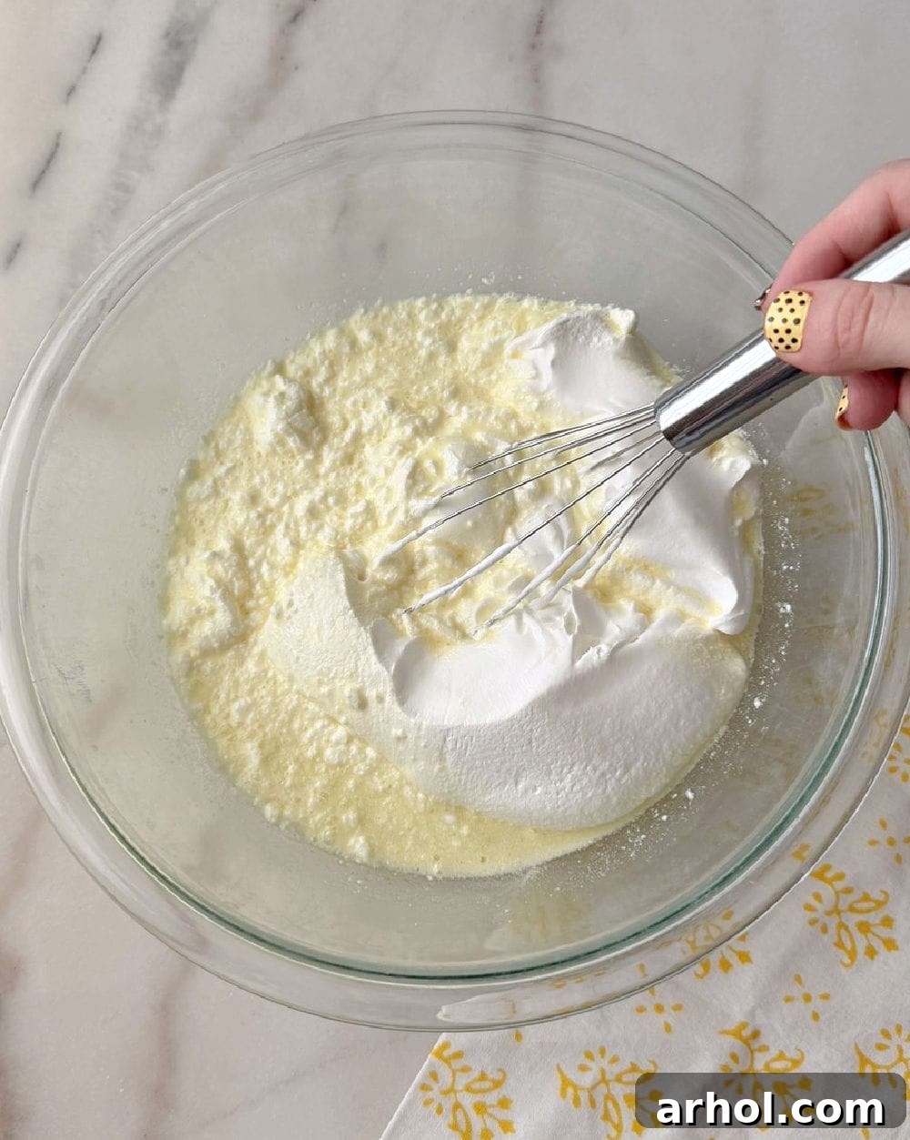 No-Bake Creamy Lemon Jello Pie 6 Adding whipped topping to the lemon mixture.