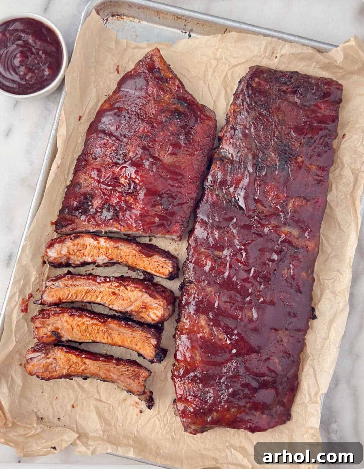 St Louis style pork ribs baked in oven with barbecue sauce.