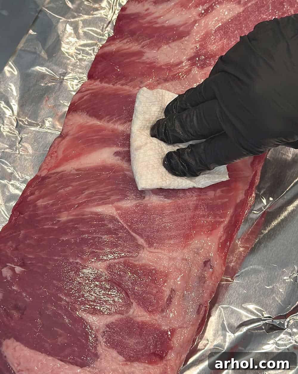 patting ribs dry with paper towel.