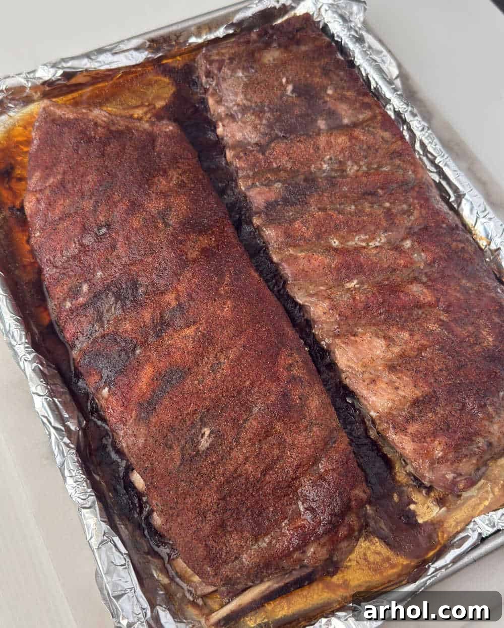 baked st louis pork ribs on baking sheet.