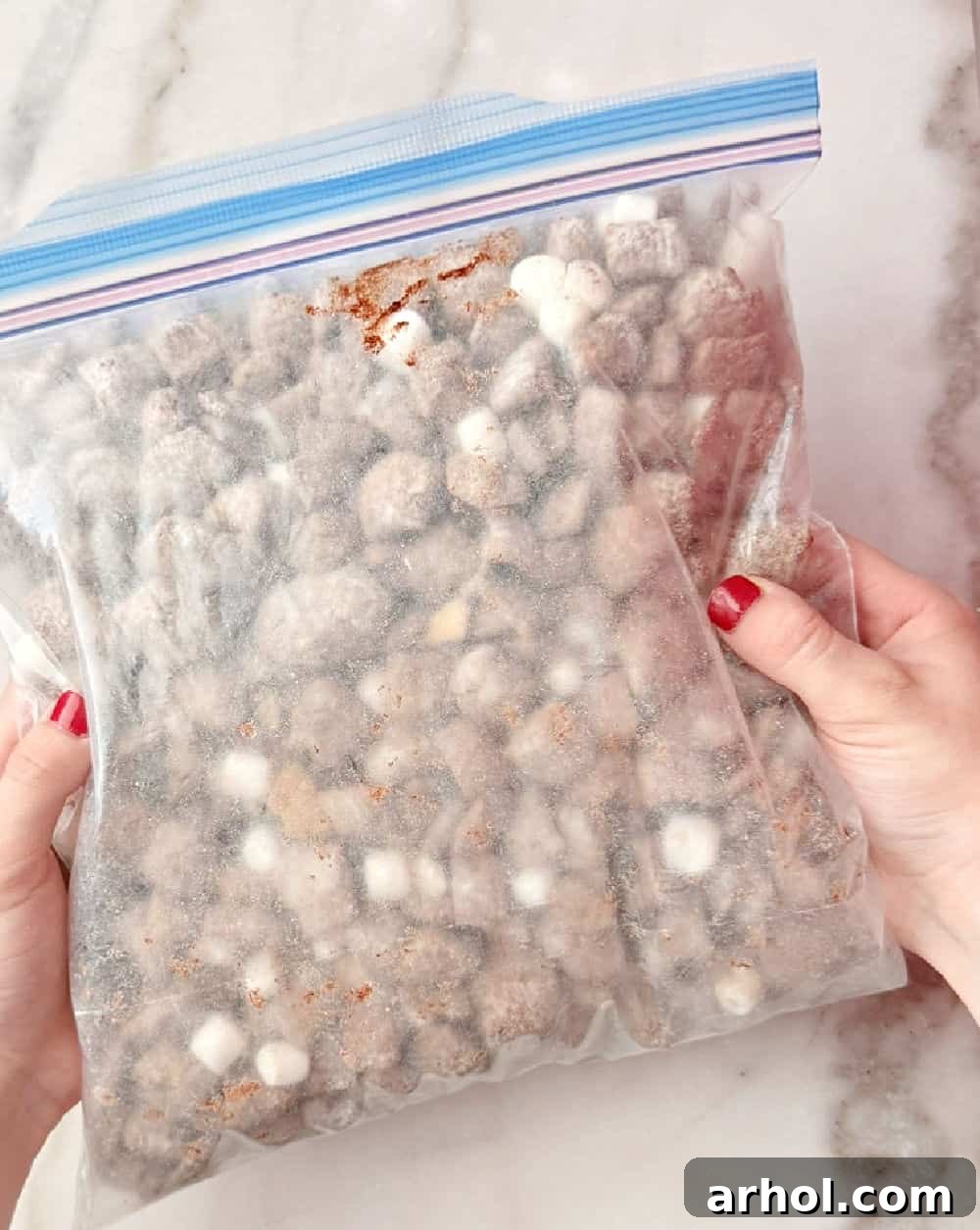 shaking muddy buddies in freezer bag.