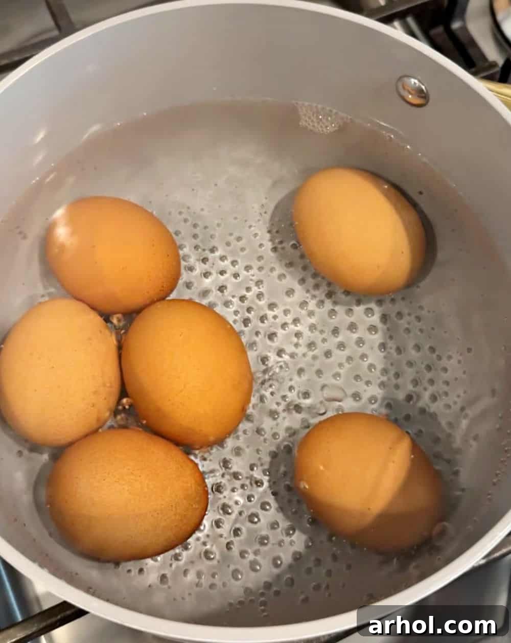eggs simmering in water.