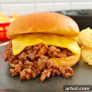 homemade sloppy joes sandwich on bun with American cheese.