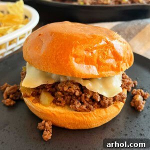Philly cheesesteak sloppy joes with melted cheese.