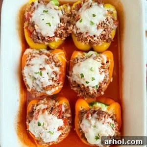 stuffed peppers baked in tomato sauce and topped with melted cheese.