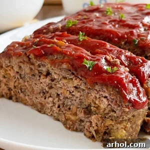 stove top stuffing meatloaf with ketchup glaze sliced on platter.