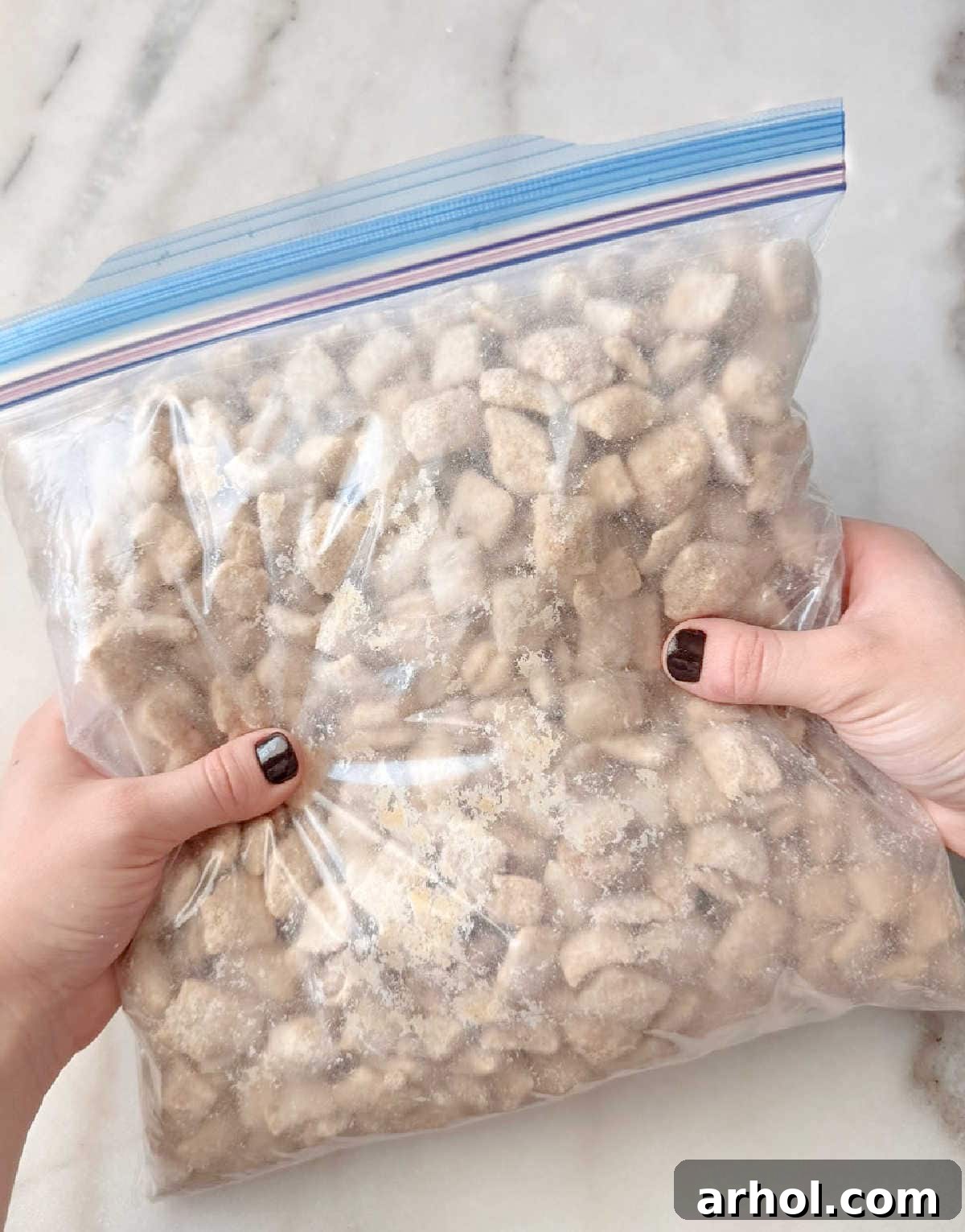 shaking muddy buddies in freezer bag.