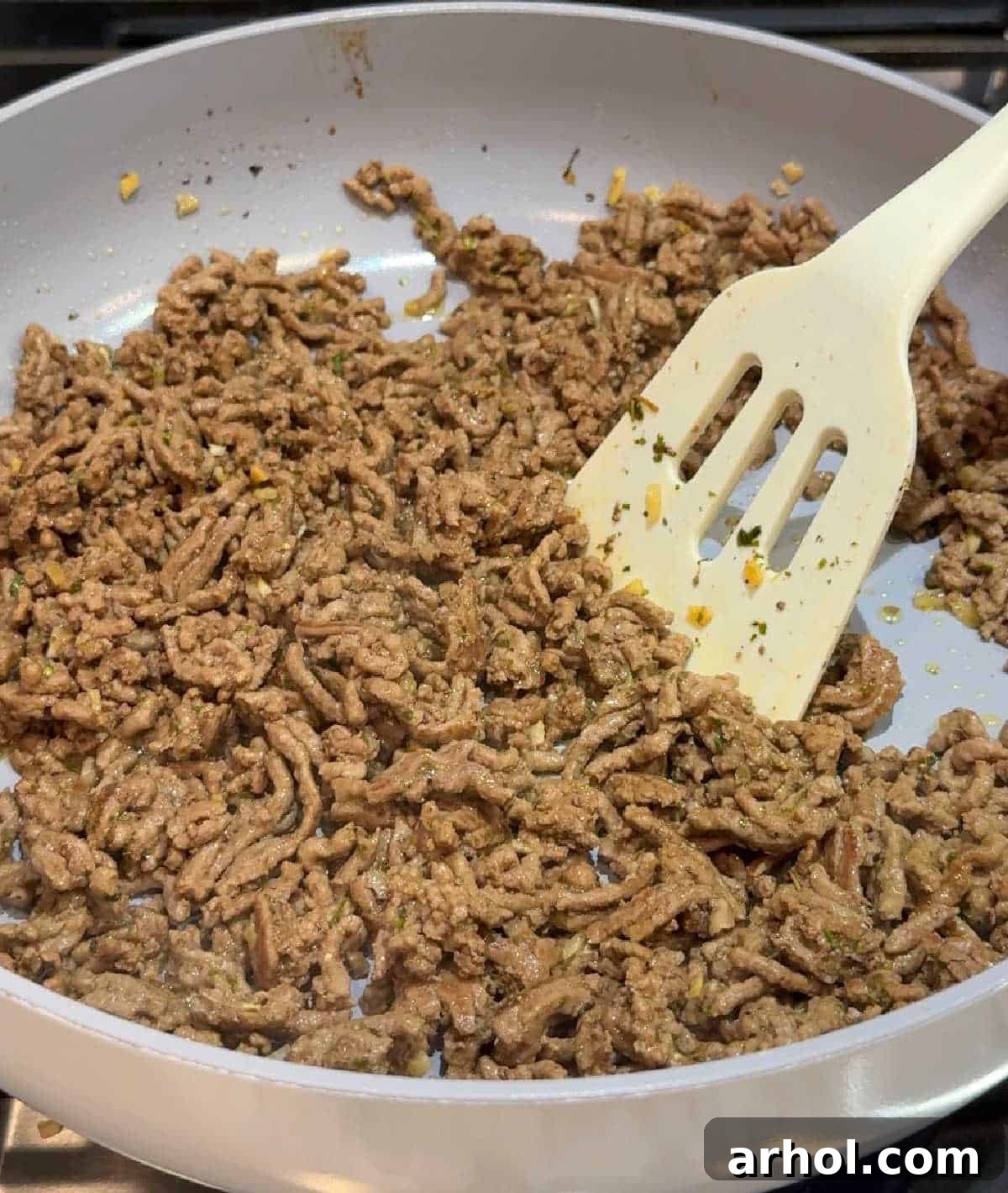 browning ground meat in skillet.