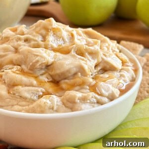 apple pie dip with caramel sauce in serving bowl.