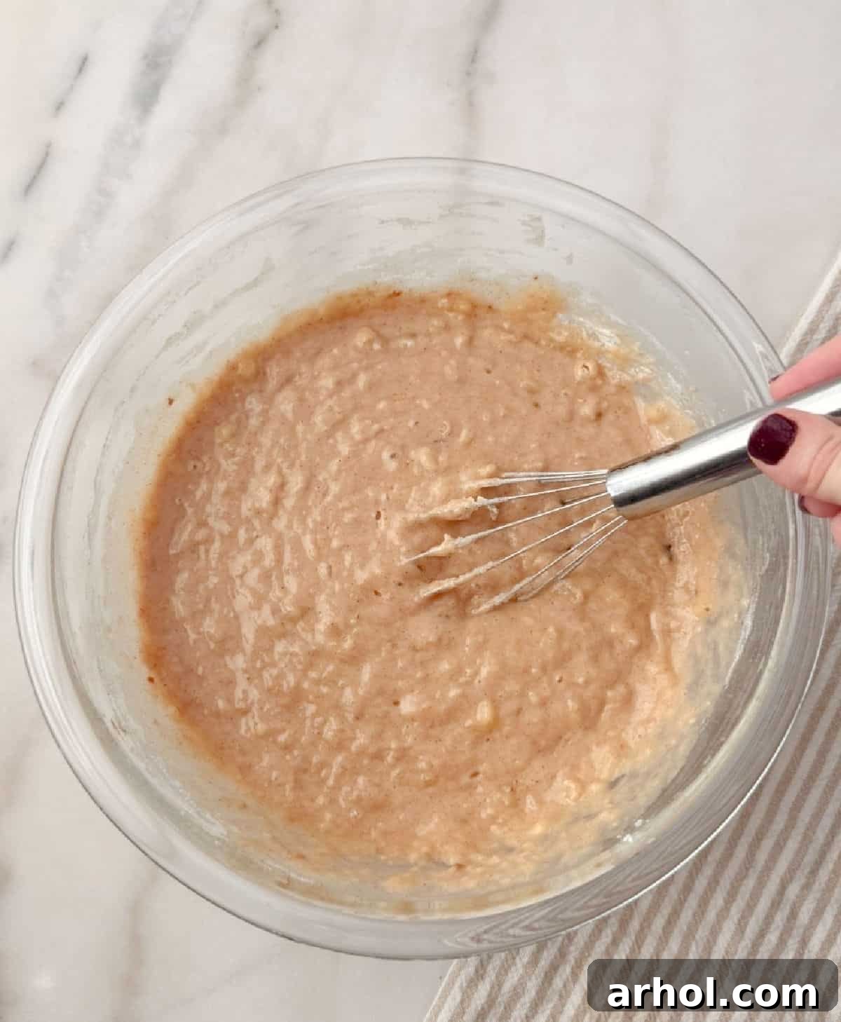 mixing ingredients in glass bowl.