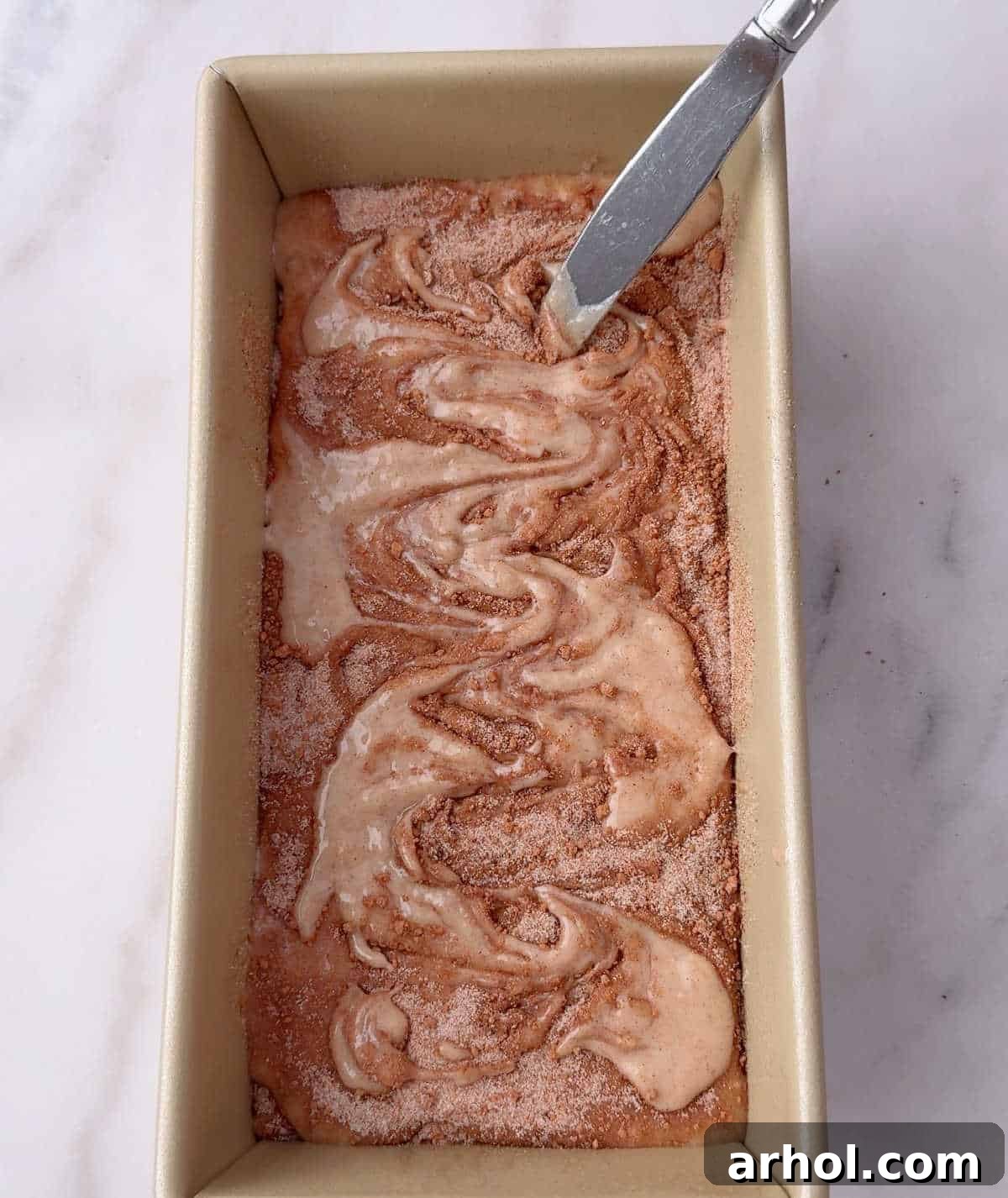 swirling cinnamon mixture with knife.