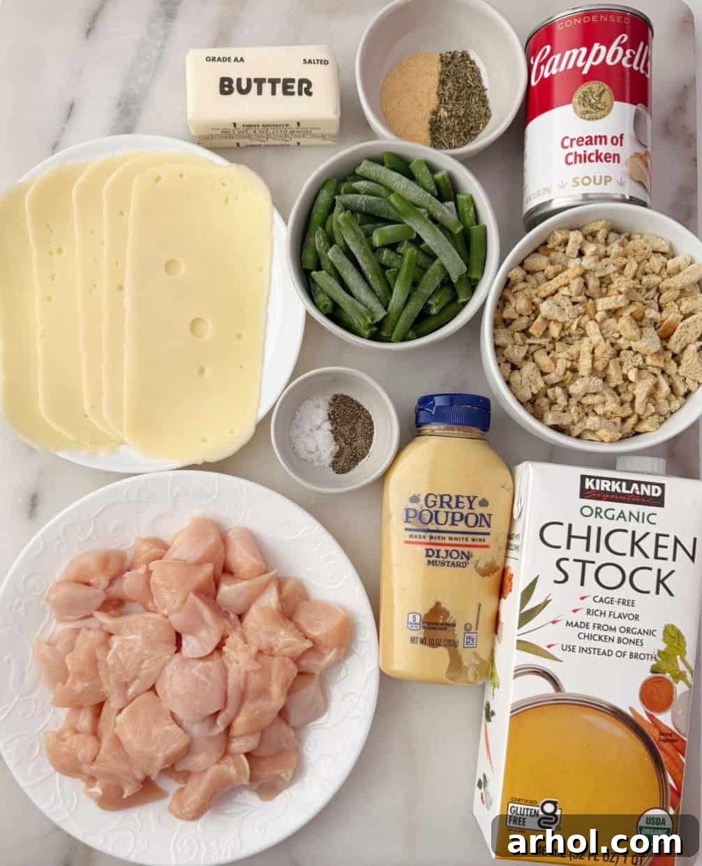 cubed chicken, Swiss cheese, stuffing mix, green beans, cream of chicken, mustard, broth, spices, butter.