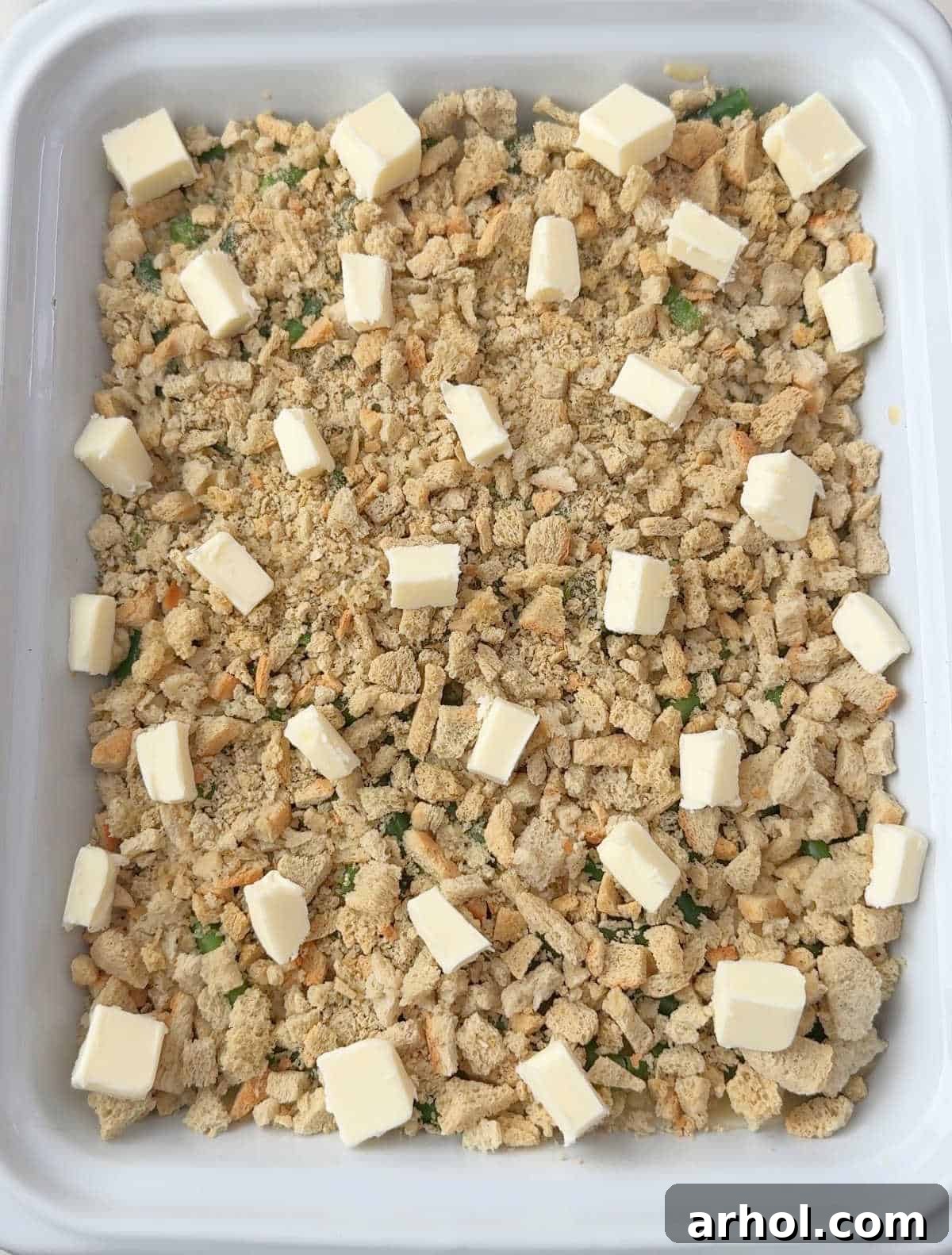 cubes of butter on top of stuffing layer.