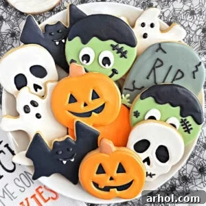 shaped halloween sugar cookies on plate.