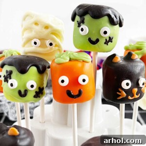 Halloween marshmallow pops in cake pops holder.