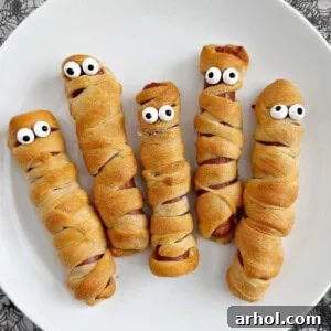 mummy dogs for halloween on a plate.