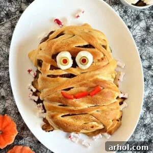 halloween meatloaf mummy on platter.